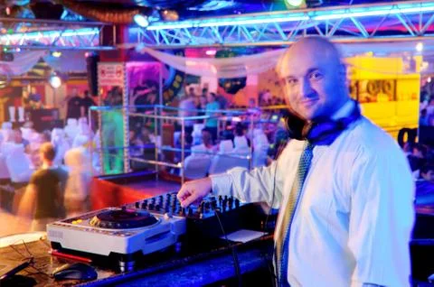 Dj behind the control panel 스톡 사진