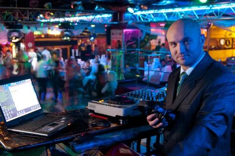 Dj behind the control panel Stock Photos