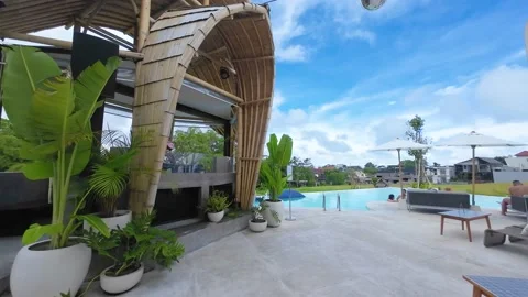 A DJ booth in a hut with pool and paddy fields on the background Stock Footage 237747254