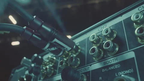 DJ checks alignment of cable connectors with input jacks Stock Footage 273613937