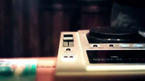 DJ at a console booth spinning and touching mixer faders and knobs Stock Footage 52056492