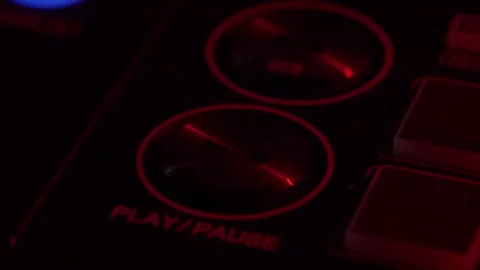 DJ Console Close-Up with Play and Pause Button Illuminated Stock Footage 258673158