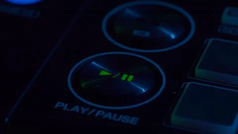DJ Console Close-Up with Play and Pause Button Illuminated Stock Photos