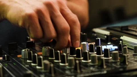 DJ at a Console Creating Music Pressing Buttons and Manipulating Knobs 스톡 동영상 299632862