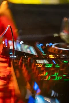 A DJ console with a green button on the right side Stock Photos