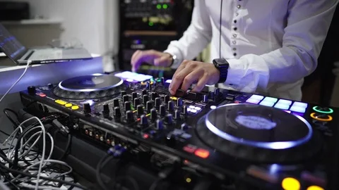 Dj at the console in a nightclub - close up on the console Video stock 114686492