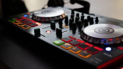 DJ controller close up view in live performance night club dance music. Stock Photos