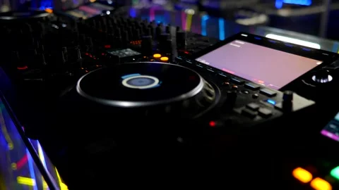 DJ Controller Display And Controls In Dark Environment. Professional Audio Mixer Stock Footage 335932706