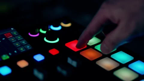 DJ controller finger pressing glowing pads Stock Footage 333064696