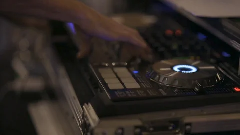 DJ controls fader turns down music with lights flashing 스톡 동영상 98545366