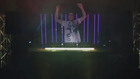 Dj dancing to the beat while playing music Stock Footage 87149761