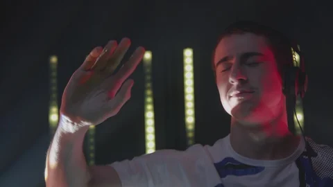 Dj dancing while playing music at nightclub Stock Footage 87151385