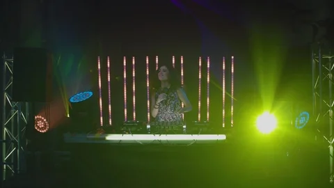 Dj dancing while playing music at nightclub Stock Footage 87153143