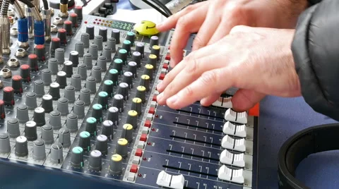 DJ deck mixing console sound board with hands Stock Footage 60128218