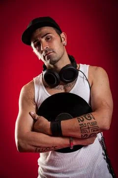 Dj in front of a red background Stock Photos