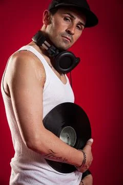 Dj in front of a red background Stock Photos