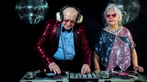 DJ grandma grandpa grandparents elderly old retired party music disco Stock Footage
