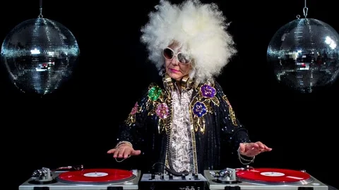 DJ grandma grandparents elderly old retired party music disco Stock Footage