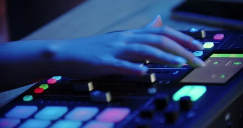 DJ hand adjusting controls on mixing console Stock Footage 315517268