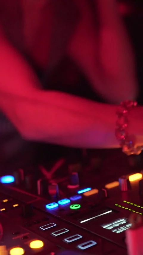 DJ Hand Adjusting Professional Audio Mixer During Nightclub Performance Stock Footage 337902633