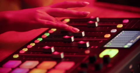 DJ hand using mixer in red light Stock Footage 315517085