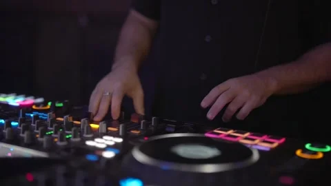 DJ hands adjusting mixing console at party. Stock Footage 322900210