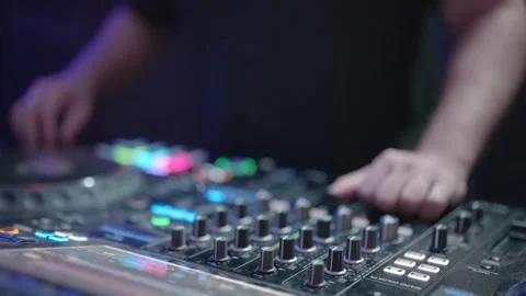 DJ hands adjusting mixing console at party. Stock Footage 322900217