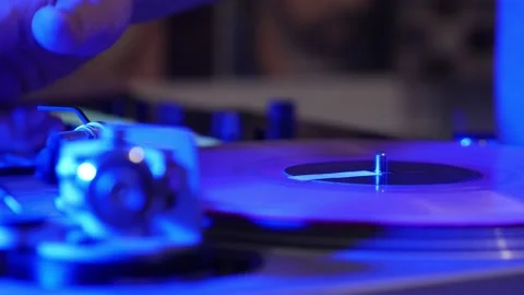 DJ Hands Close Up As He Places Stylus On Vinyl And Begins Mixing On Turn Stock Footage 140238834