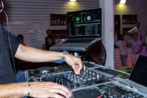 Dj hands on equipment deck . Stock Photos