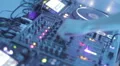 DJ hands mixing tracks on turntable at club, switching controls HD Footage