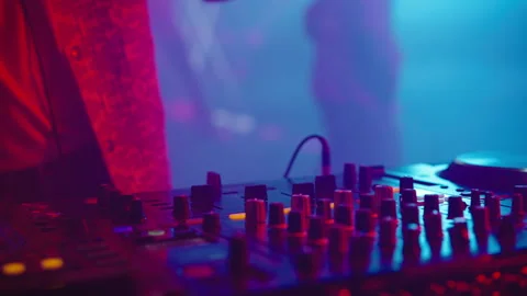 DJ hands moving controls on mixing desk 스톡 동영상 170200551