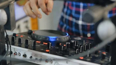 DJ Hands touching Buttons and Sliders Playing Electronic Music. Close-Up of Dj Stock Footage 124695975