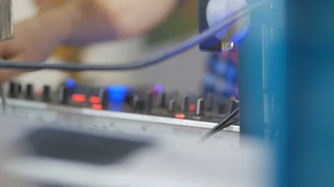 DJ Hands touching Buttons and Sliders Playing Electronic Music. Close-Up of Dj Stock Footage 124695991