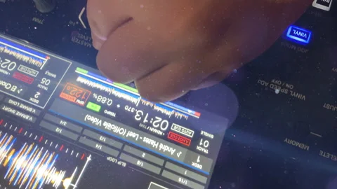DJ hands touching buttons and sliders playing electronic music Video stock 229500684