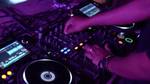 DJ Hands touching Buttons and Sliders Playing Electronic Music Stock Footage 245473842