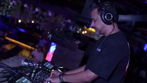 DJ Hands touching Buttons and Sliders Playing Electronic Music Stock Footage 245473886