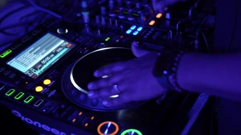 DJ Hands touching Buttons and Sliders Playing Electronic Music Stock Footage 245473922