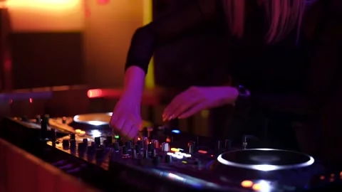 DJ Hands touching Buttons and Sliders Playing Electronic Music Stock Footage 245473924
