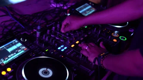 DJ Hands touching Buttons and Sliders Playing Electronic Music Stock Footage 245473942