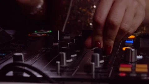 DJ hands turning knobs - dj console close up Stock Footage 139977880