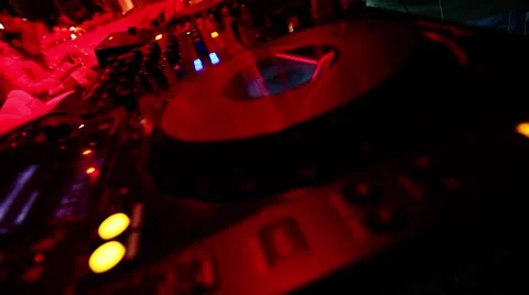 DJ hands tweak various track controls on dj's deck Stock Footage 68408110