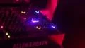 Dj hands tweaking turntable or mixer, light splashes in nightclub HD Footage