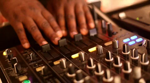 DJ hands working slider controls on a turntable. Stock Footage 301102