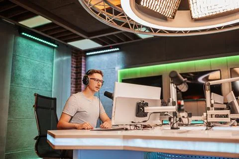 The DJ hosts the program and communicates with the audience on air at the rad Stock Photos