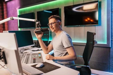 The DJ hosts the program and communicates with the audience on air at the rad Stock Photos