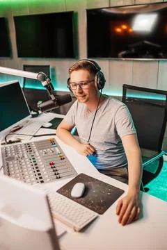 The DJ hosts the program and communicates with the audience on air at the rad Stock Photos