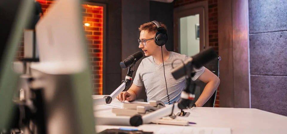 The DJ hosts the program and communicates with the audience on air at the rad Stock Photos