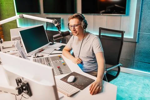 The DJ hosts the program and communicates with the audience on air at the rad Stock Photos