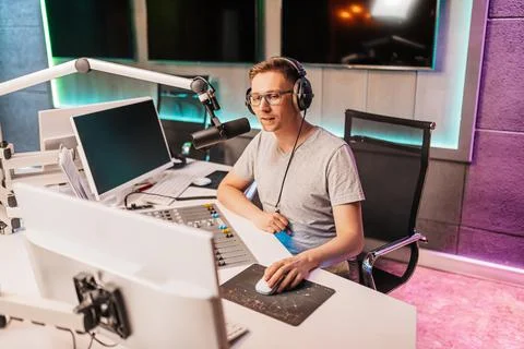 The DJ hosts the program and communicates with the audience on air at the rad Stock Photos