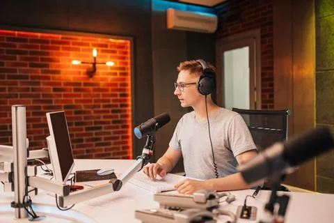The DJ hosts the program and communicates with the audience on air at the rad Stock Photos